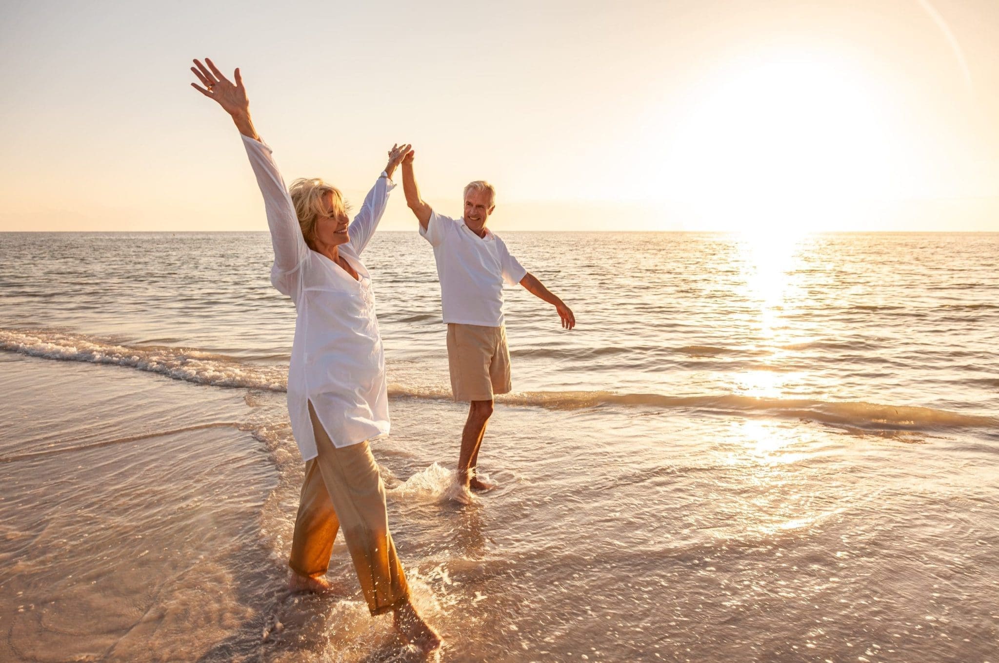 Couple on the beach enjoying retirement