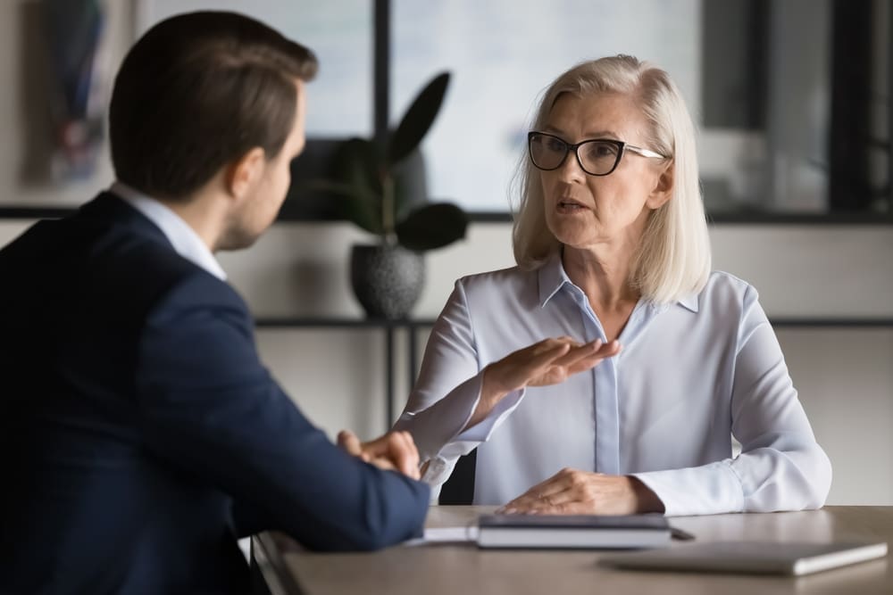 A family lawyer explains financial disclosure obligations to a client during divorce proceedings.