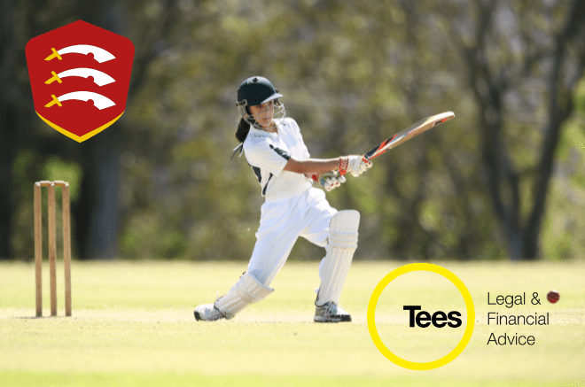 girl hitting a ball with a cricket bat