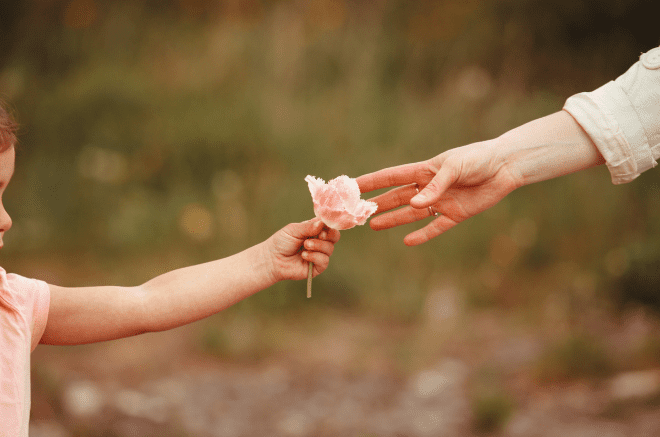 a child hands a flower to a mother, ockenden report
